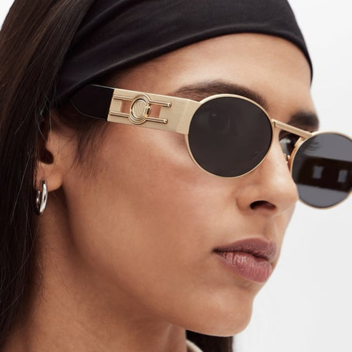 Dame rund solbrille med moderne metallramme og UV-beskyttelse Luvikno