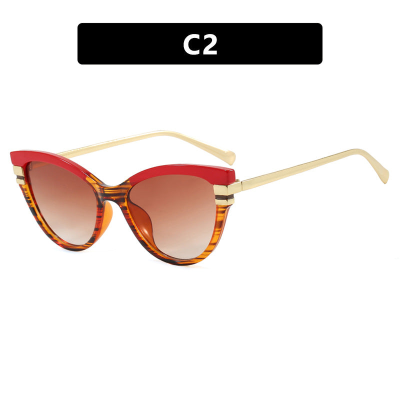 Dame Cat-Eye solbriller med elegant plastramme og gullaccentuer Luvikno