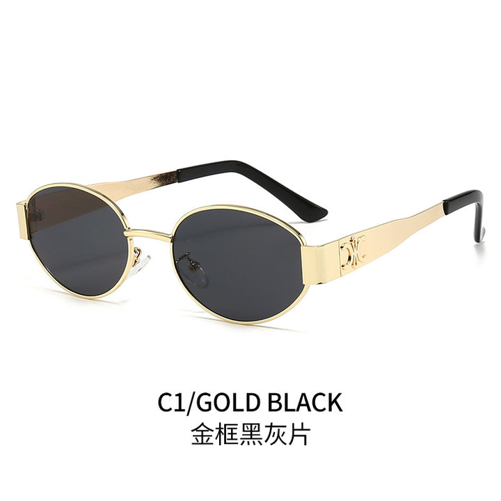 Dame Designer-solbrille med elegant oval ramme og unike aksenter Luvikno