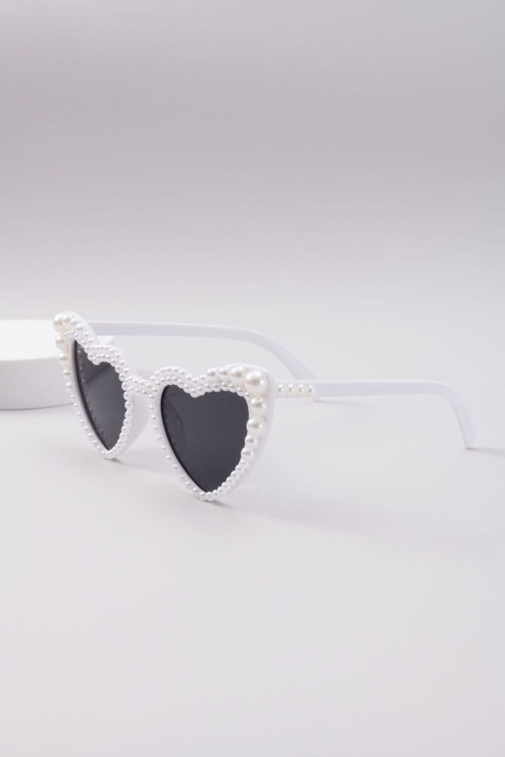 Dame designer solbrille med perleinnramming fra Luvikno