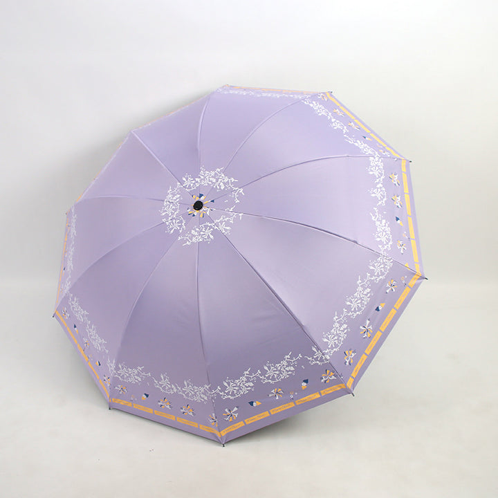 Kvinnens elegante sammenleggbare paraply med blomsterdesign Luvikno