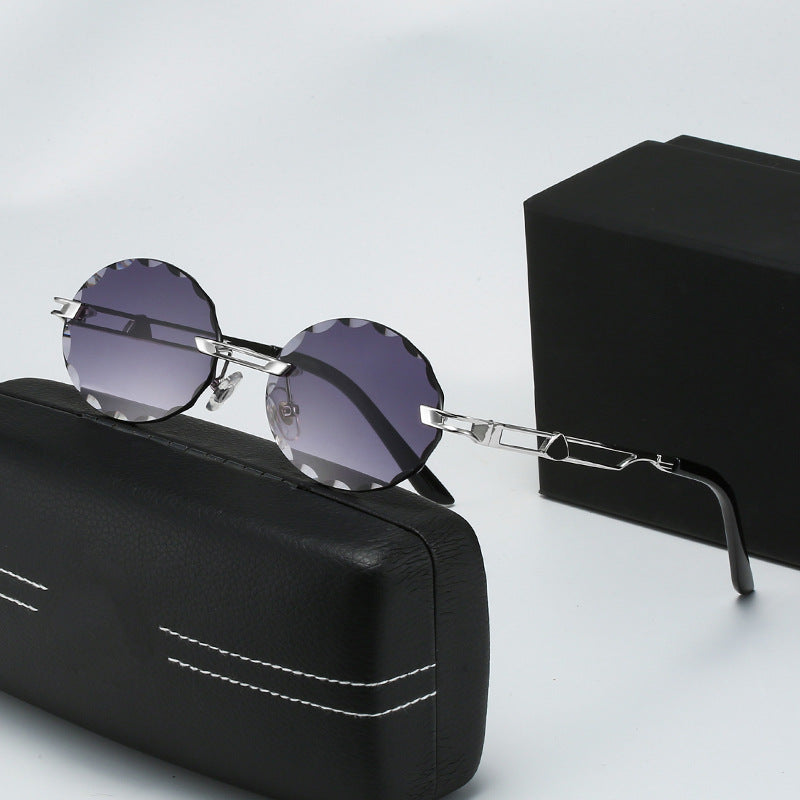 Dame rund solbrille med unikt bølgedesign og høykvalitets metallramme Luvikno