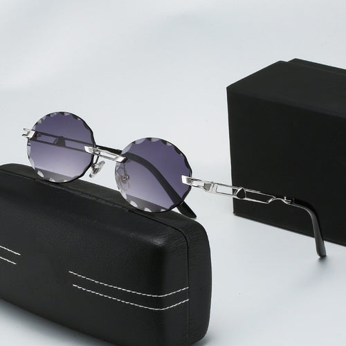 Dame rund solbrille med unikt bølgedesign og høykvalitets metallramme Luvikno