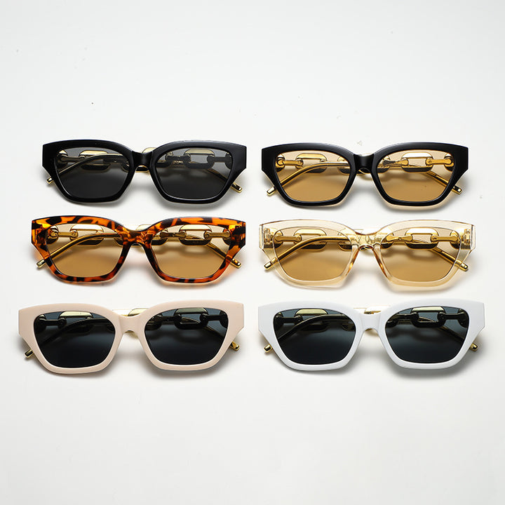 Dame Cat-Eye solbrille med dekorativ kjettingramme Luvikno
