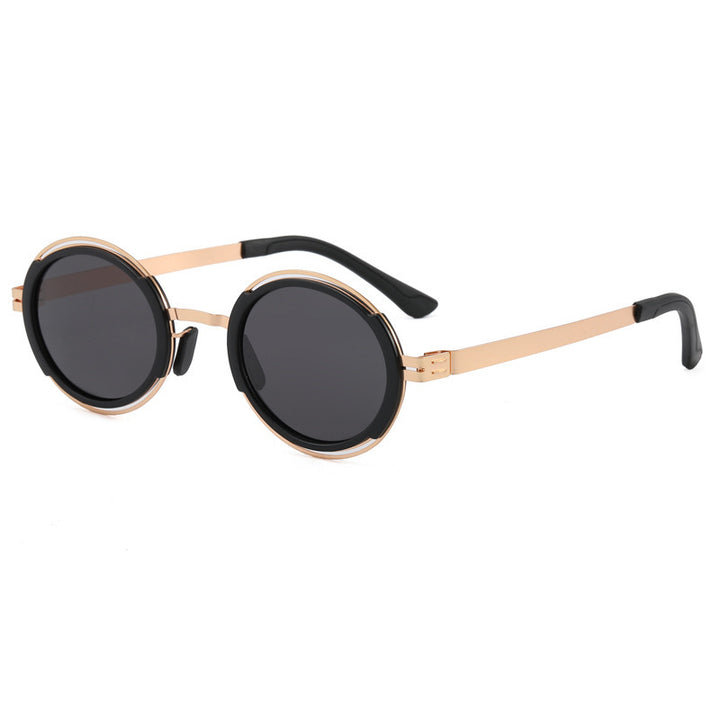 Damer moteriktig rund solbrille med elegant metallramme Luvikno
