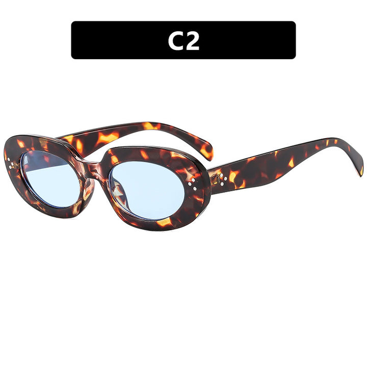 Dame moteriktig solbrille med unikt ovalt ramme og beskyttende glass Luvikno