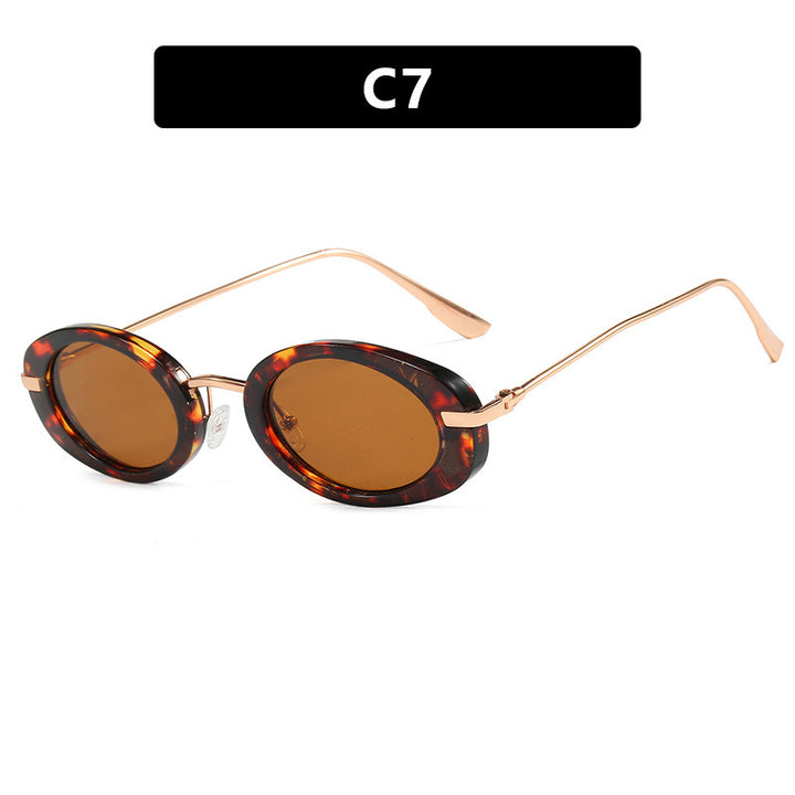 Dame moteriktig solbrille i elegant ovalt design Luvikno