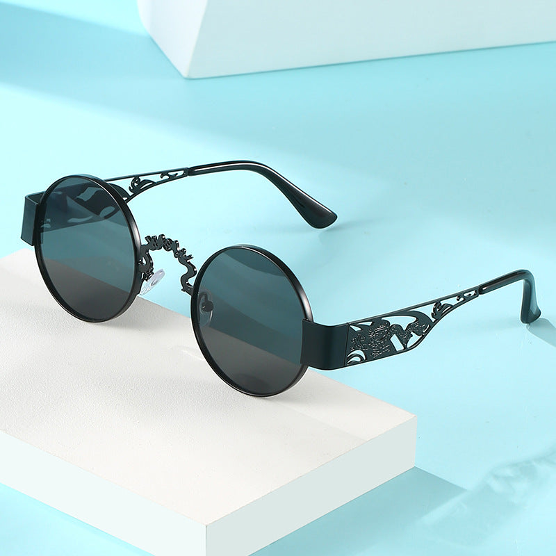 Dame kunstnerisk rundt solbrille med elegant filigranramme Luvikno