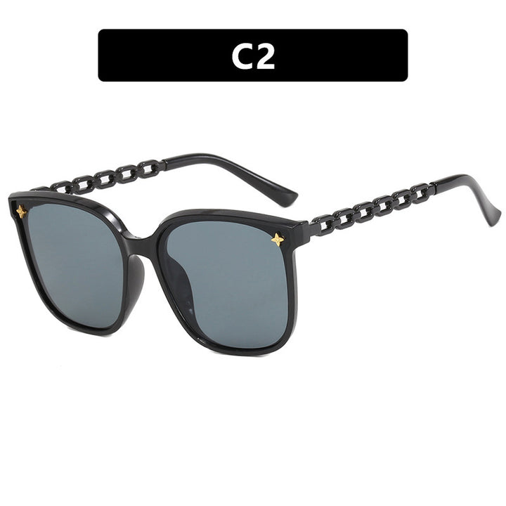 Dame moteriktig solbrille med stilige kjedeakenter Luvikno