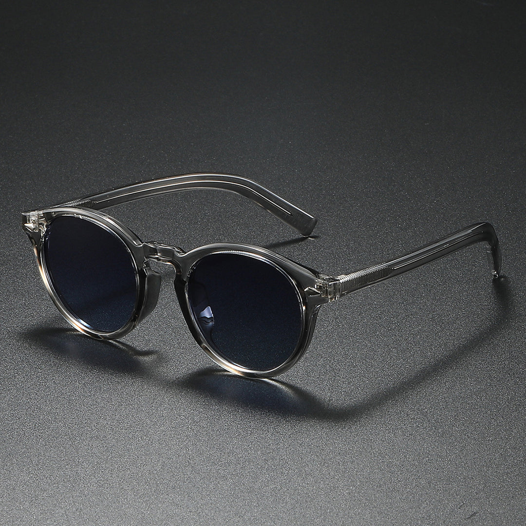 Dame Rund-solbrille med transparent ramme og reflekterende glass Luvikno