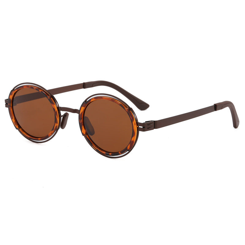 Damer moteriktig rund solbrille med elegant metallramme Luvikno