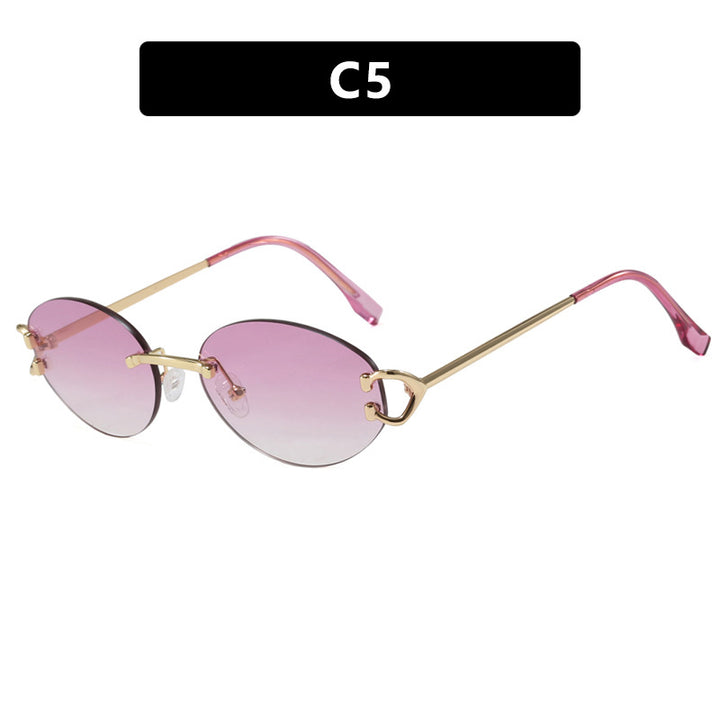 Dame elegant ovalformet solbrille med moderne metalramme Luvikno