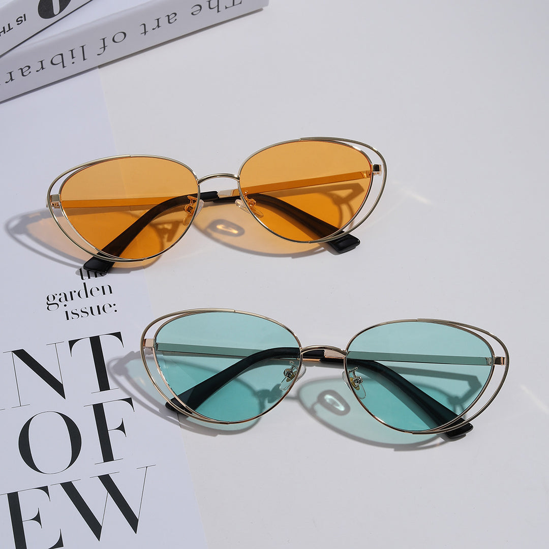 Dame geometrisk solbrille med rødt glass og elegant metallramme Luvikno