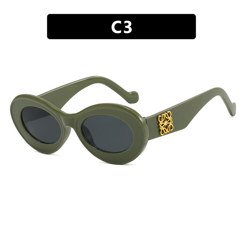 Dame fashionable solbriller med oval ramme og gullakenter Luvikno
