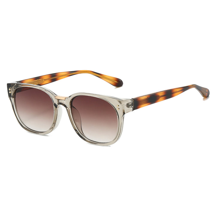 Dame moteriktig solbrille med gjennomsiktig ramme og elegante detaljer Luvikno