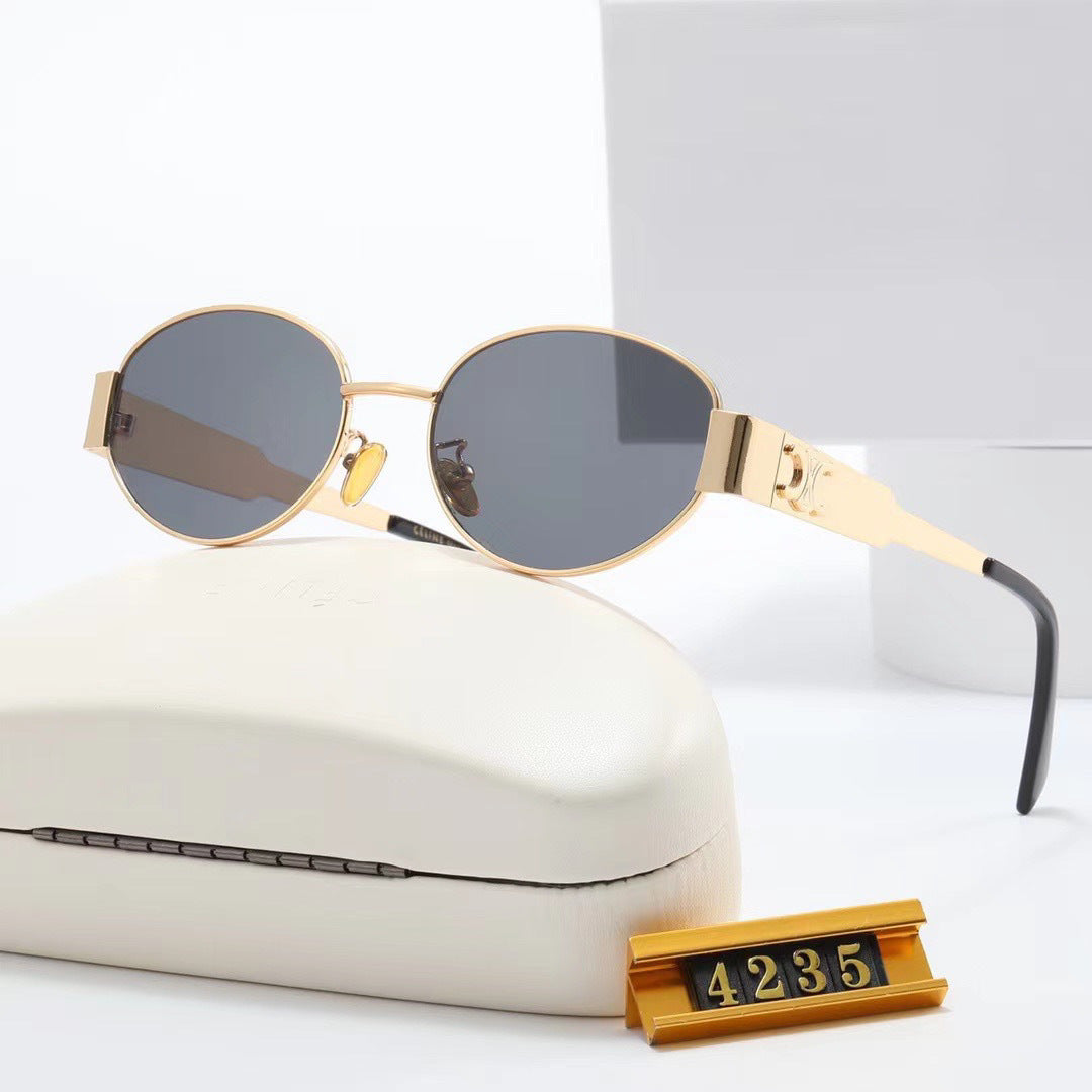 Dame elegant oval solbrille med gullfarget ramme Luvikno