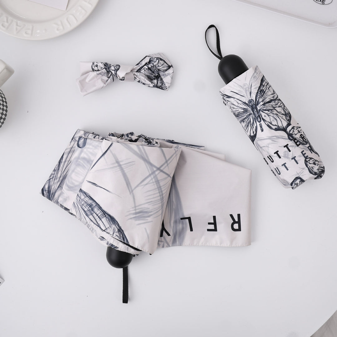 Dame fashionable foldeparaply med leken design Luvikno