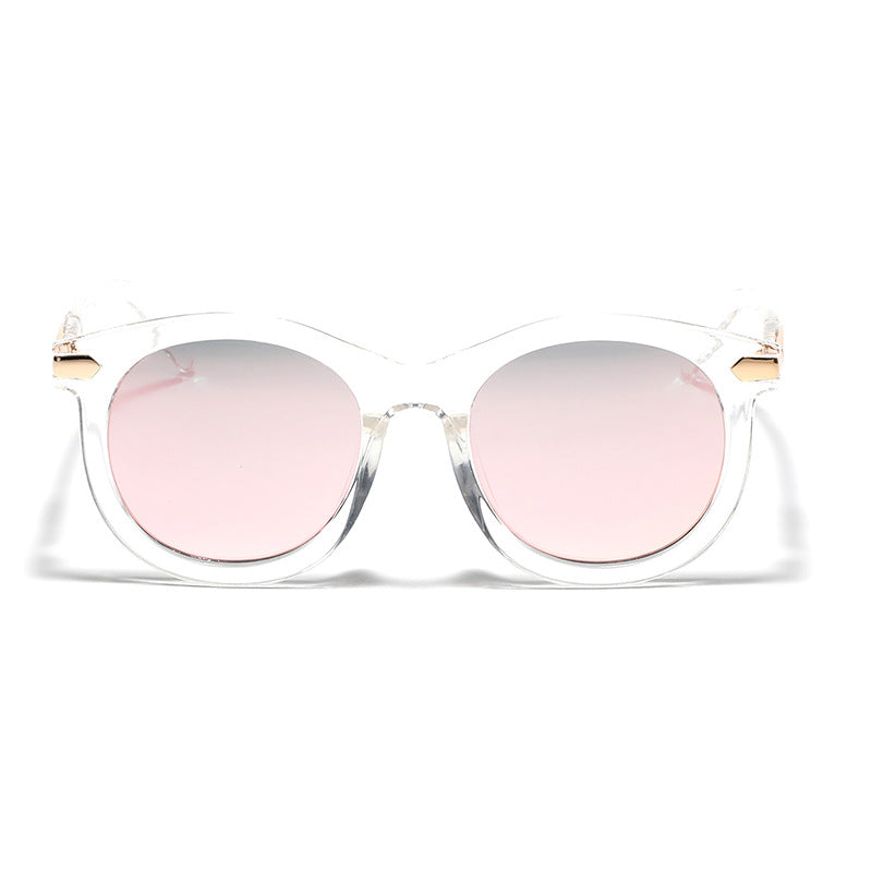 Dame moteriktig solbrille med gjennomsiktig ramme og gull accenter Luvikno