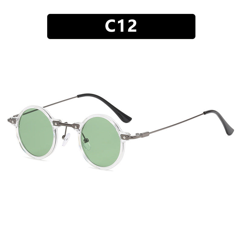 Dame rund solbrille med moderne metallramme og store blå linser Luvikno
