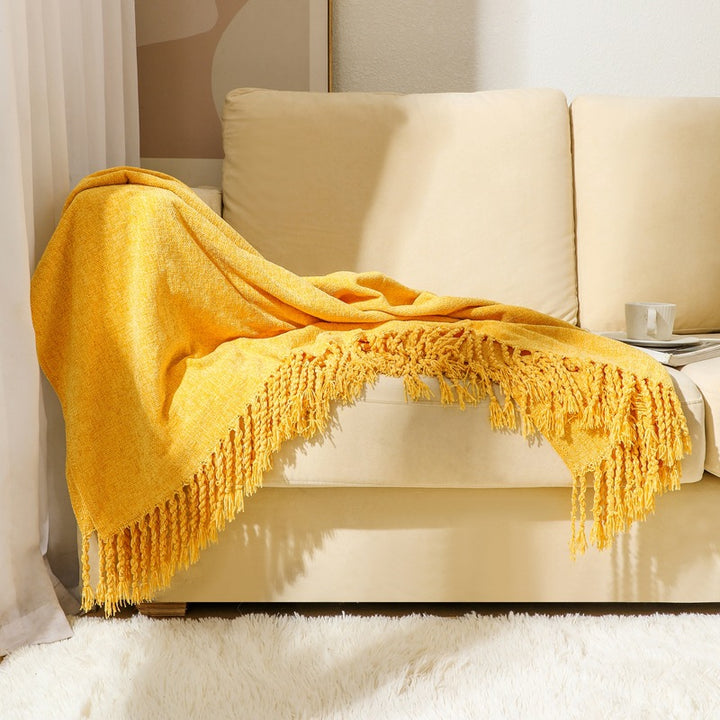 Kvinnelig elegant og stilfull sofa teppe med frynser Luvikno