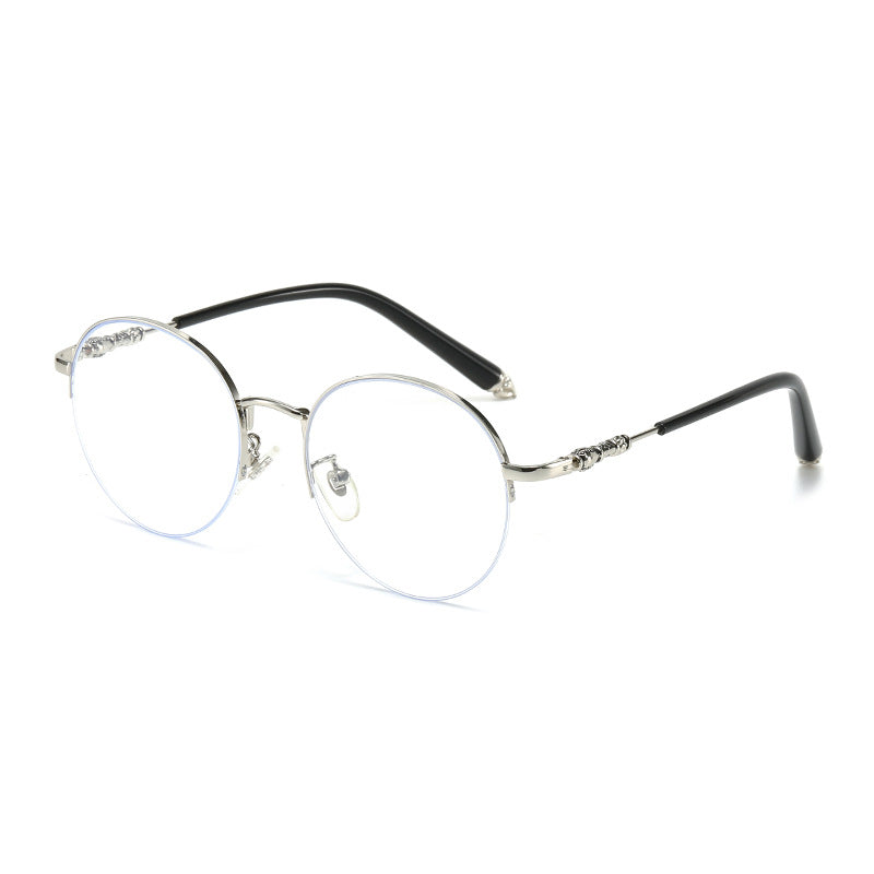 Dame rund solbrille med elegant metallramme og komfortable nesepads Luvikno