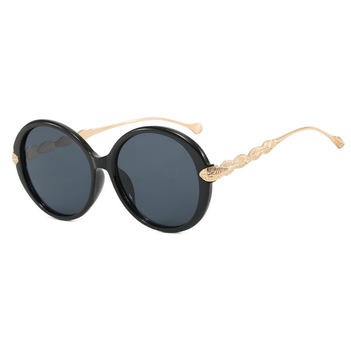 Dame stor rund solbrille med dekorative metalakser Luvikno