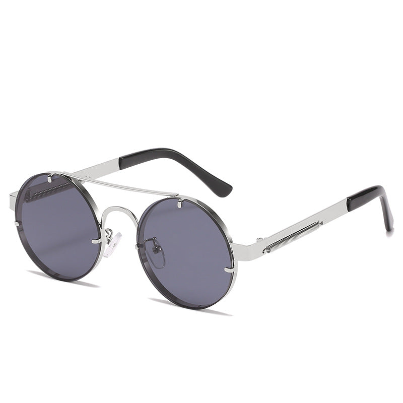 Dame rund designer solbrille med innovativ metallramme og beskyttende linser Luvikno