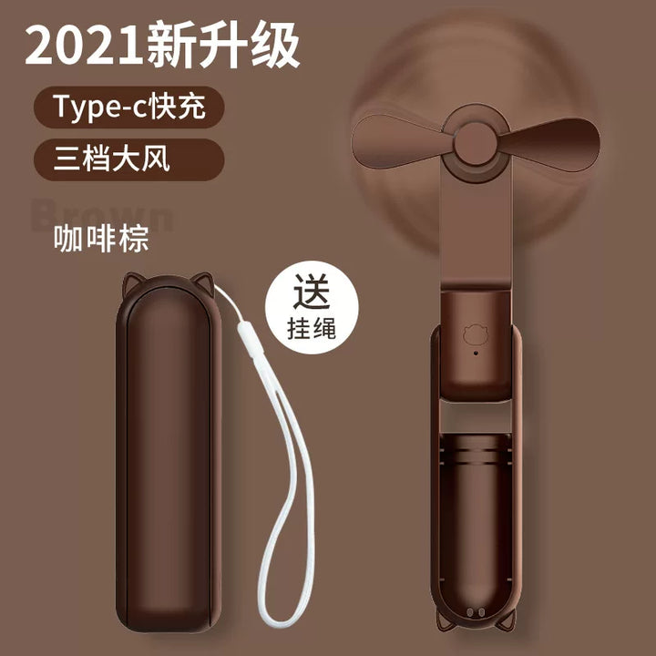 Unisex en størrelse sammenleggbar oppladbar trippel håndholdt mini vifte med innebygd powerbank USB-C og USB-A tilkoblinger samt håndleddsstropp Luvikno
