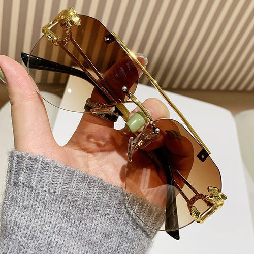 Dame Designer solbrille med unikt dyreakcent Luvikno
