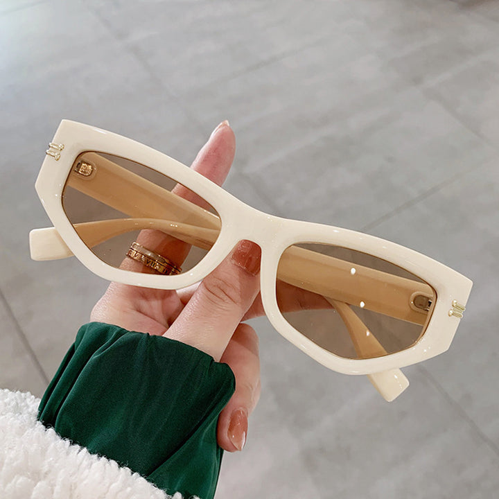 Dame geometrisk solbrille med bøyd ramme og beskyttende UV-filter Luvikno