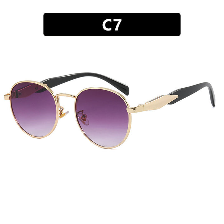 Dame rund solbrille med elegant, gullramme og UV-beskyttelse Luvikno