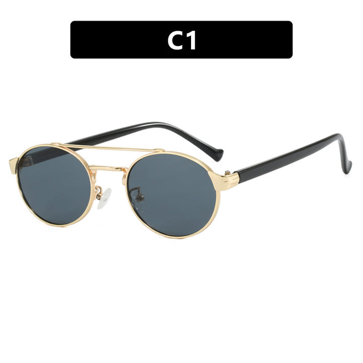 Dame moteriktig solbrille i stilfullt rundt design med gull aksenter Luvikno