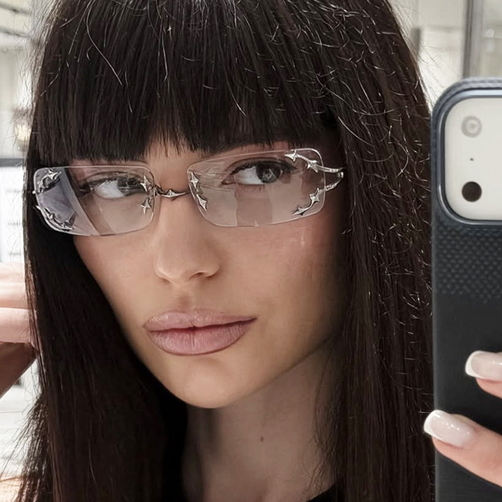 Dame moteriserte solbriller med filigran metallramme og transparente glass Luvikno