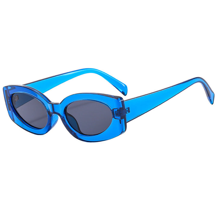 Dame moteriktig solbrille med unikt, bølget ramme Luvikno