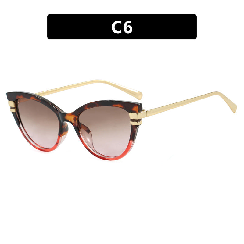Dame Cat-Eye solbriller med elegant plastramme og gullaccentuer Luvikno