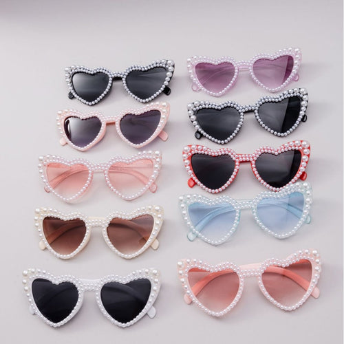 Dame designer solbrille med perleinnramming fra Luvikno