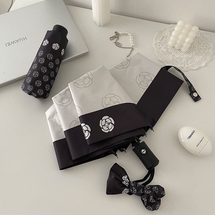 Dame elegant paraply med stilfullt blomsterdesign Luvikno