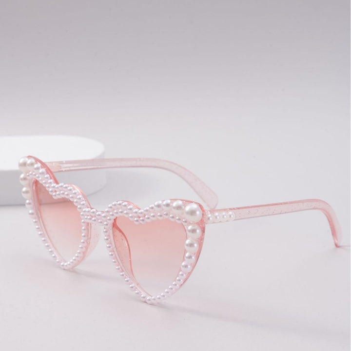Dame designer solbrille med perleinnramming fra Luvikno