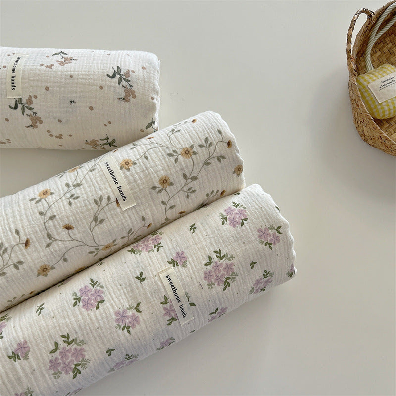 Unisex allsidig muslinteppe med blomstrete detaljer Luvikno