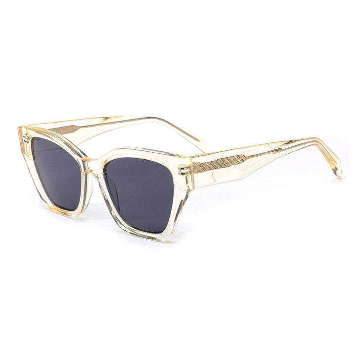 Dame solbrille med moderne ramme og lekne detaljer Luvikno
