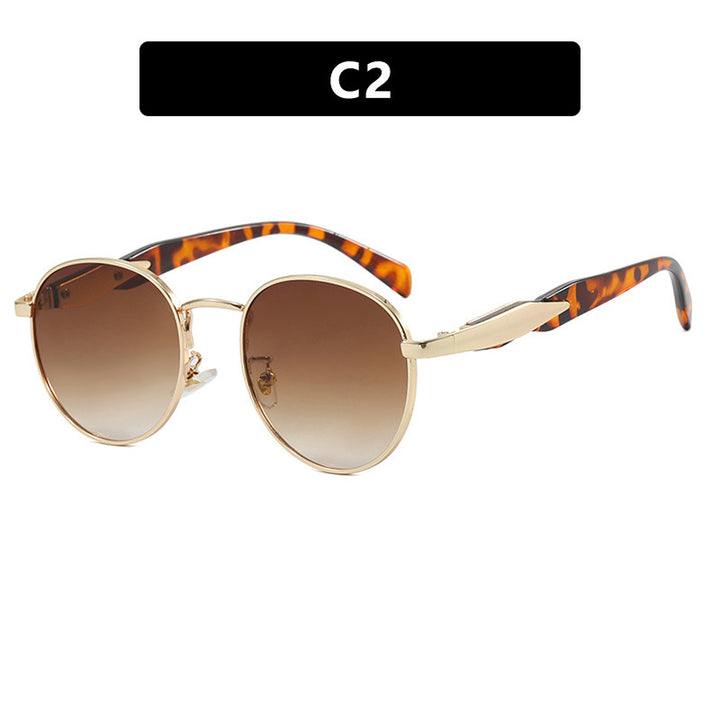 Dame rund solbrille med elegant, gullramme og UV-beskyttelse Luvikno
