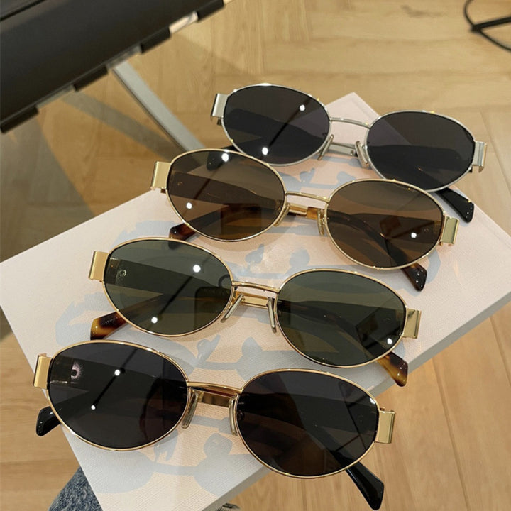 Dame elegant oval solbrille med gullfarget ramme Luvikno