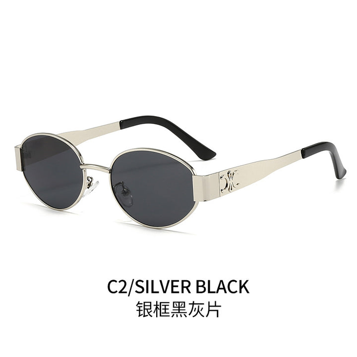 Dame Designer-solbrille med elegant oval ramme og unike aksenter Luvikno