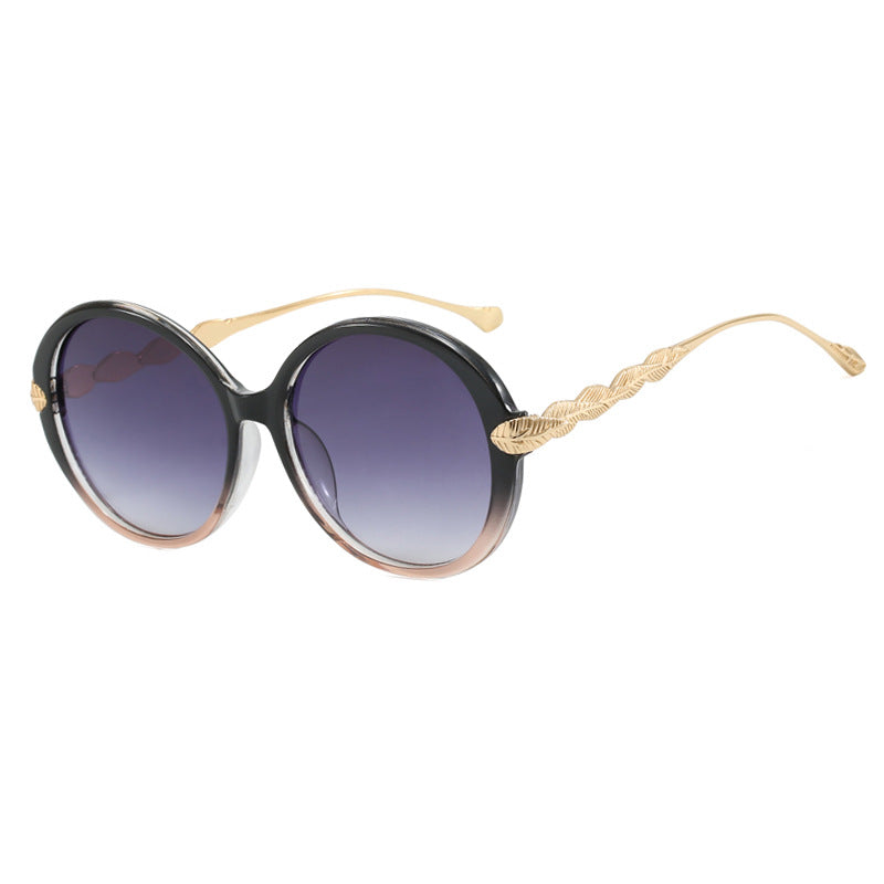 Dame stor rund solbrille med dekorative metalakser Luvikno