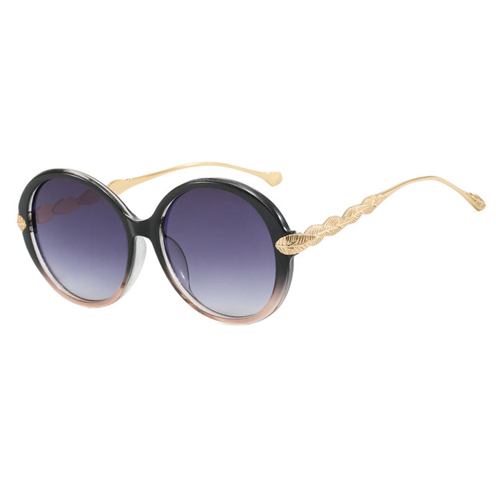 Dame stor rund solbrille med dekorative metalakser Luvikno