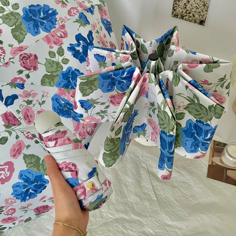 Dame folde paraply med høykvalitets blomsterdesign Luvikno