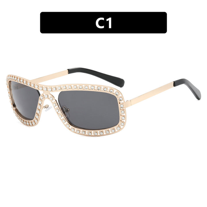 Dame moteriktig solbrille med glitrende ramme Luvikno