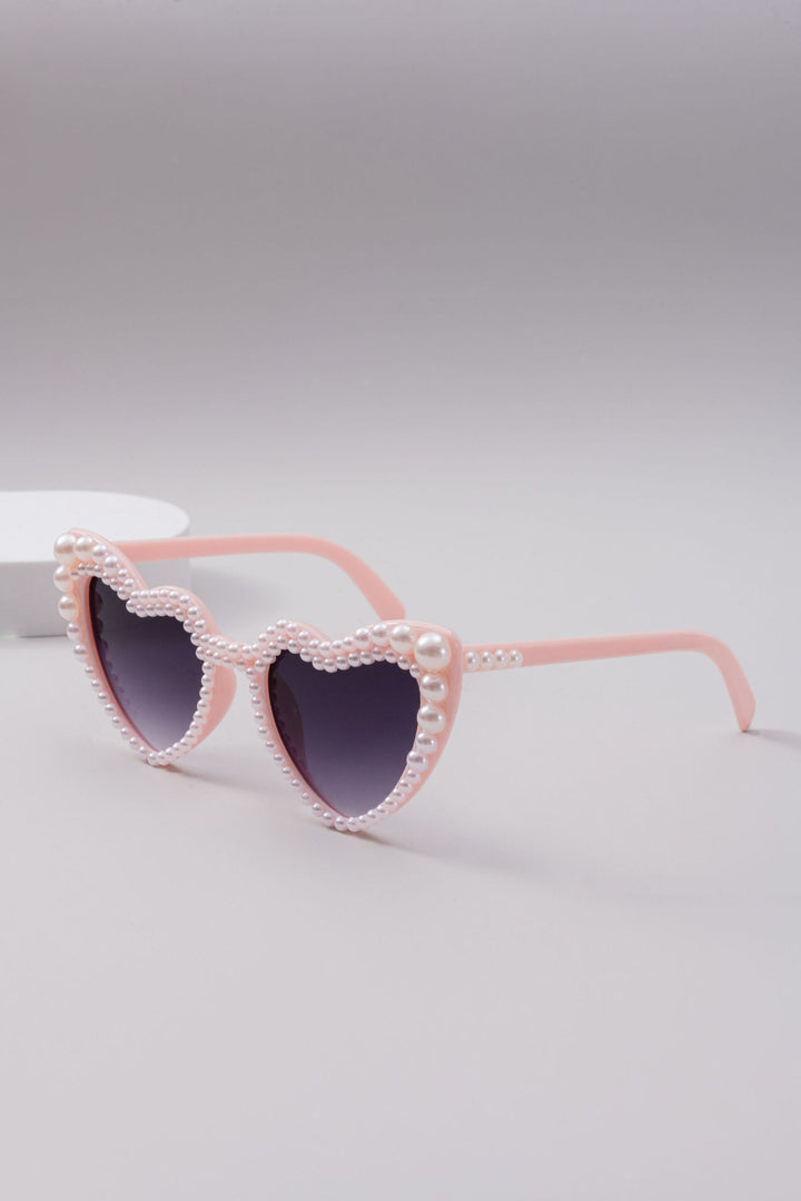 Dame designer solbrille med perleinnramming fra Luvikno