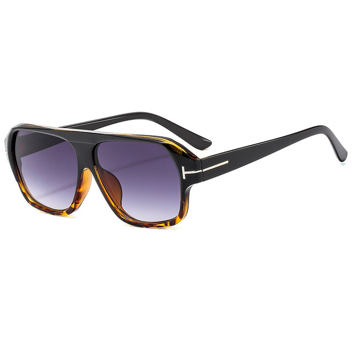Dame modische solbrille med markant geometri og brune glass Luvikno