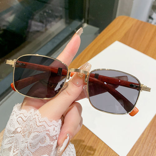 Dame solbrille med luksuriøs treinnfatning Luvikno